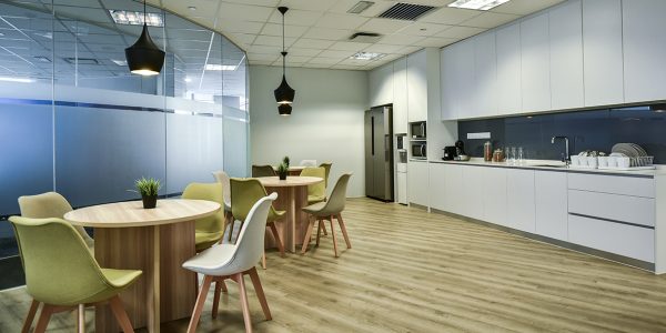 Open-plan workspace in Valmont office featuring ergonomic furniture and lighting